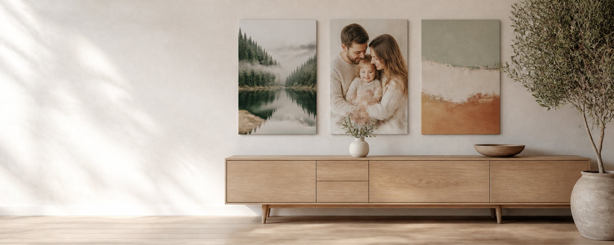 Living room with three canvas prints above a pale oak sideboard