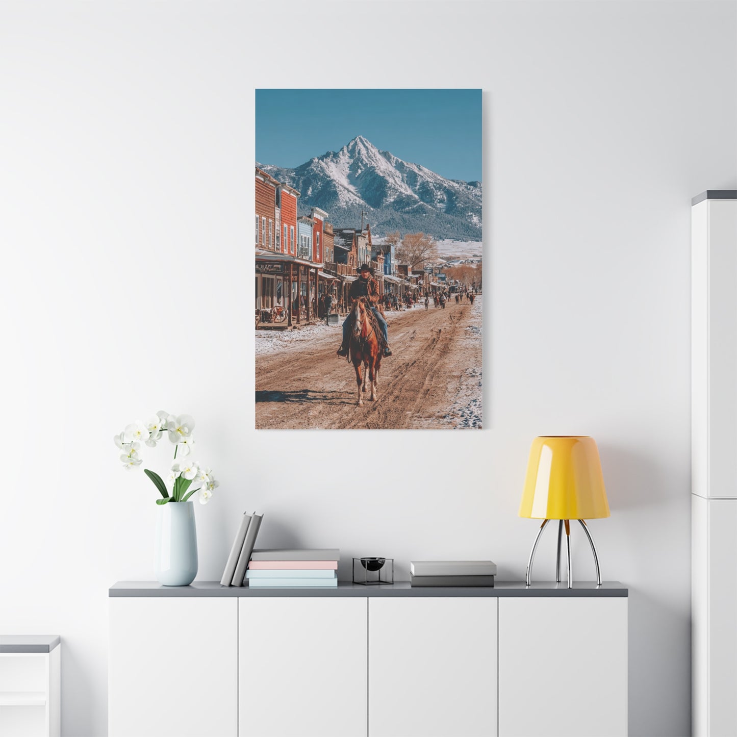 Cowboy Riding Through a Frontier Mountain Town Wall Art & Canvas Print